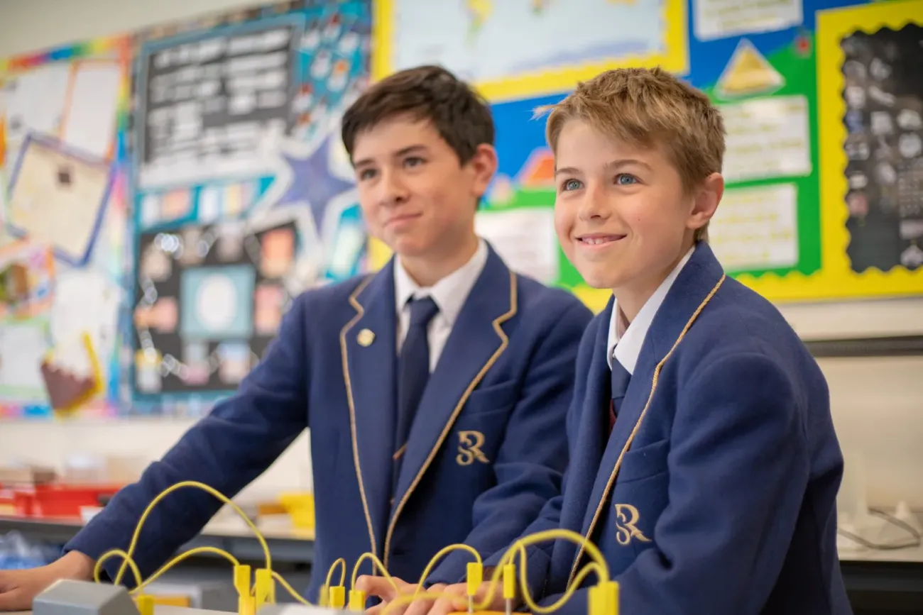Two boys working in science classroom
