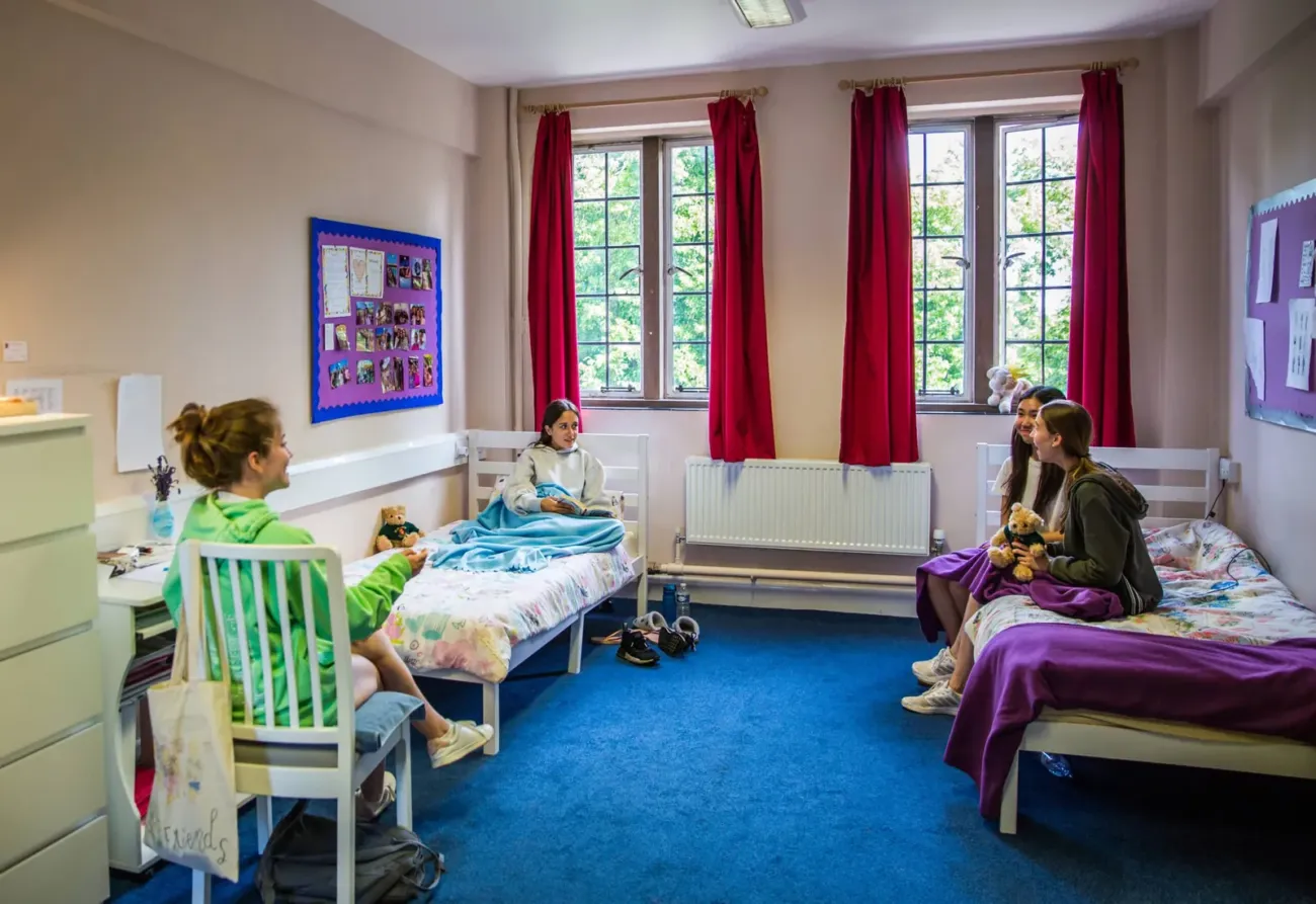 Girls chatting in shared boarding room