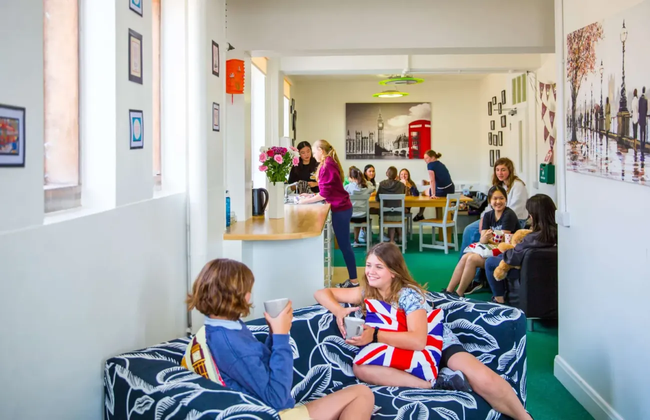 Students relaxing in boarding house common room