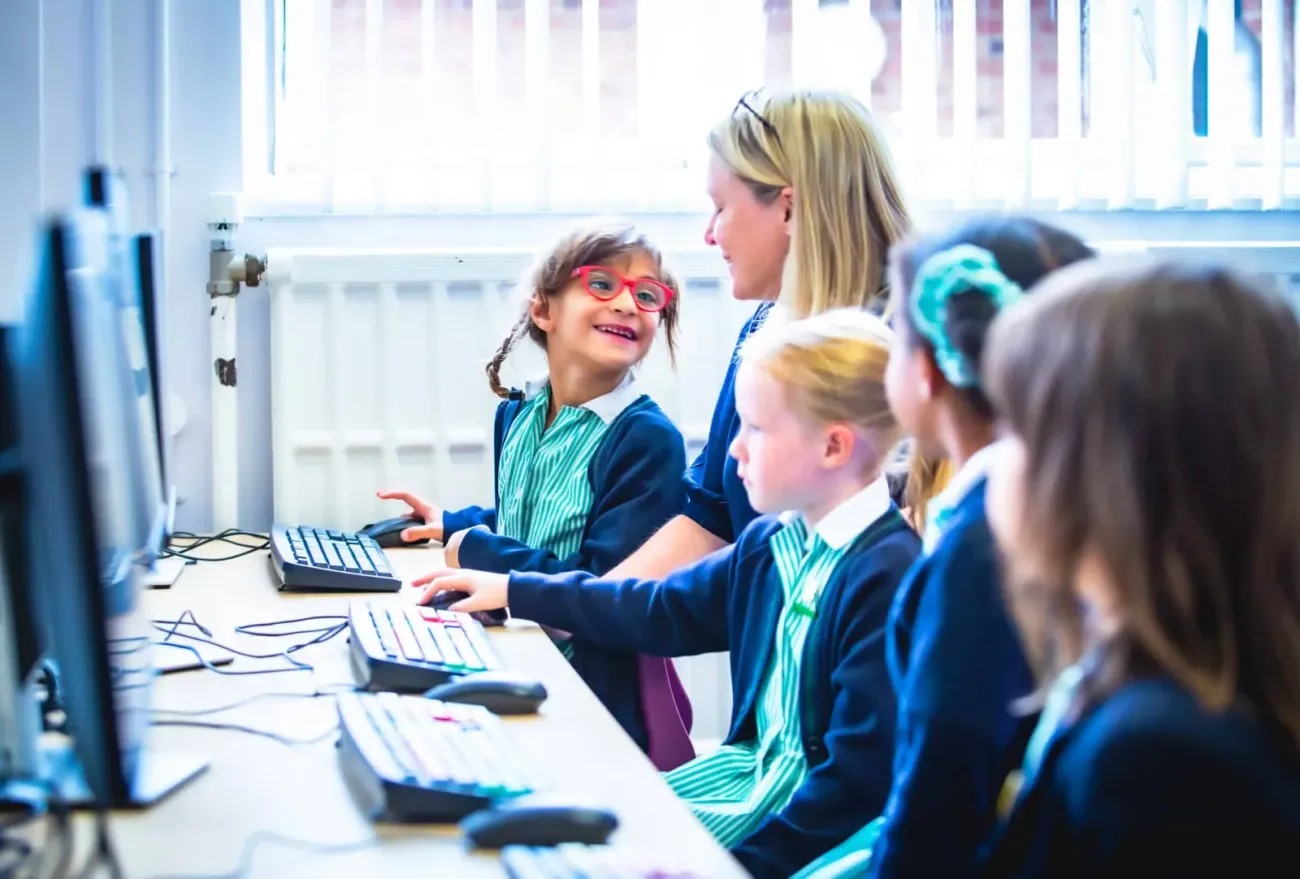 Young pupils in computer class