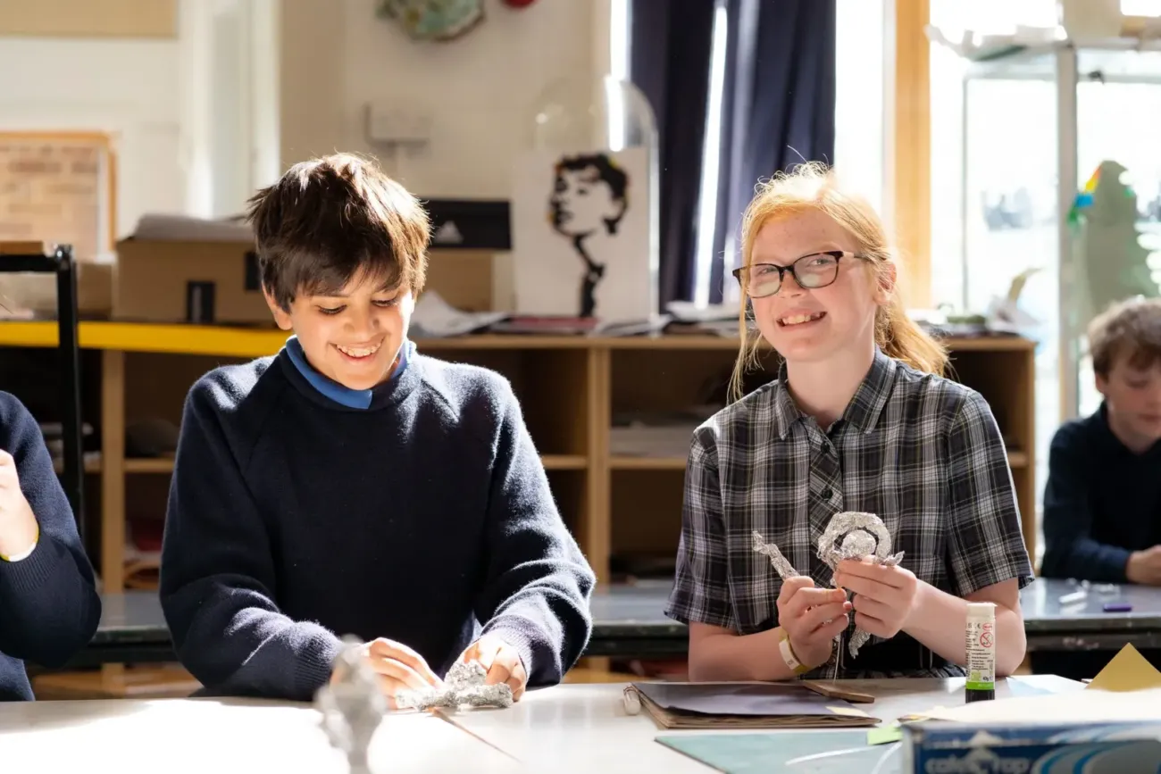 Students crafting aluminium foil sculptures