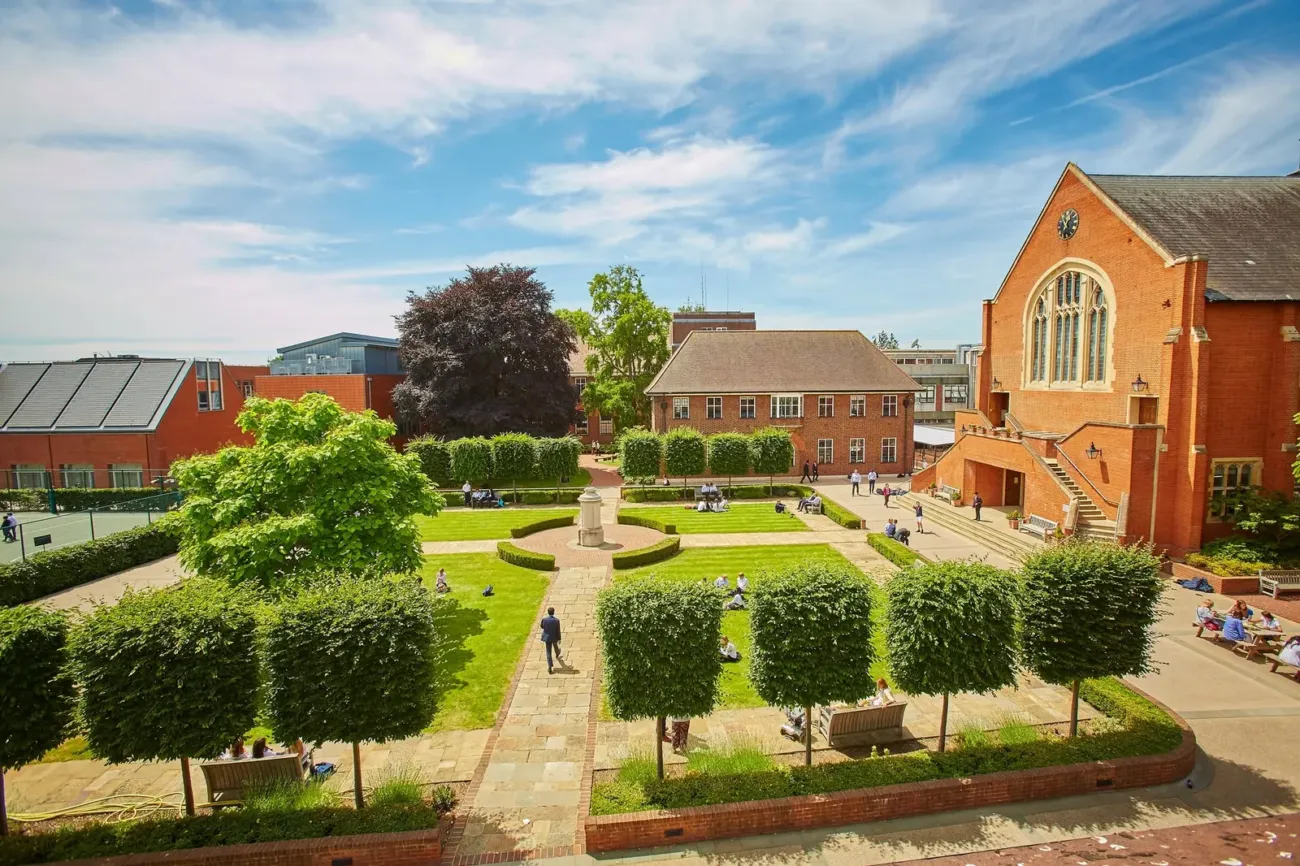 Formal garden courtyard with students relaxing