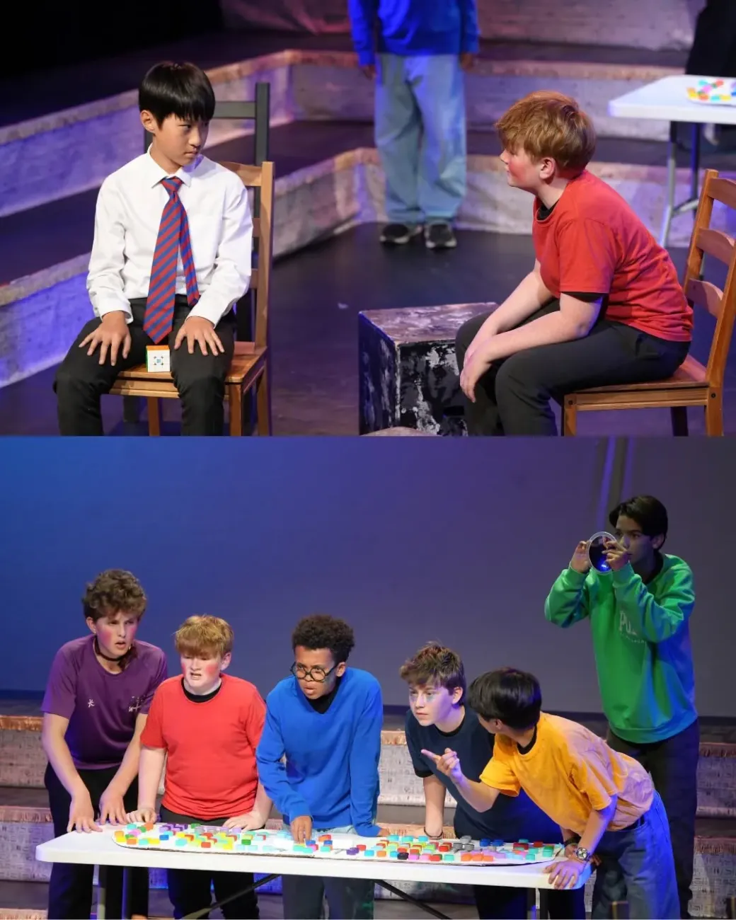 Boys performing in dramatic stage production