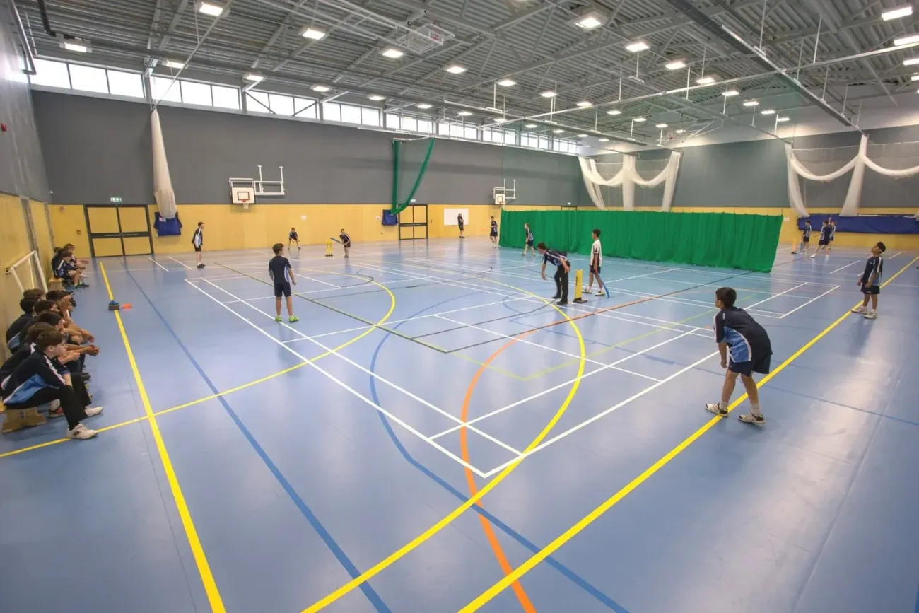 Students playing indoor cricket together